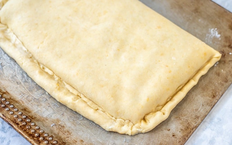 A Rudarska Greblica pastry dough on a baking sheet.