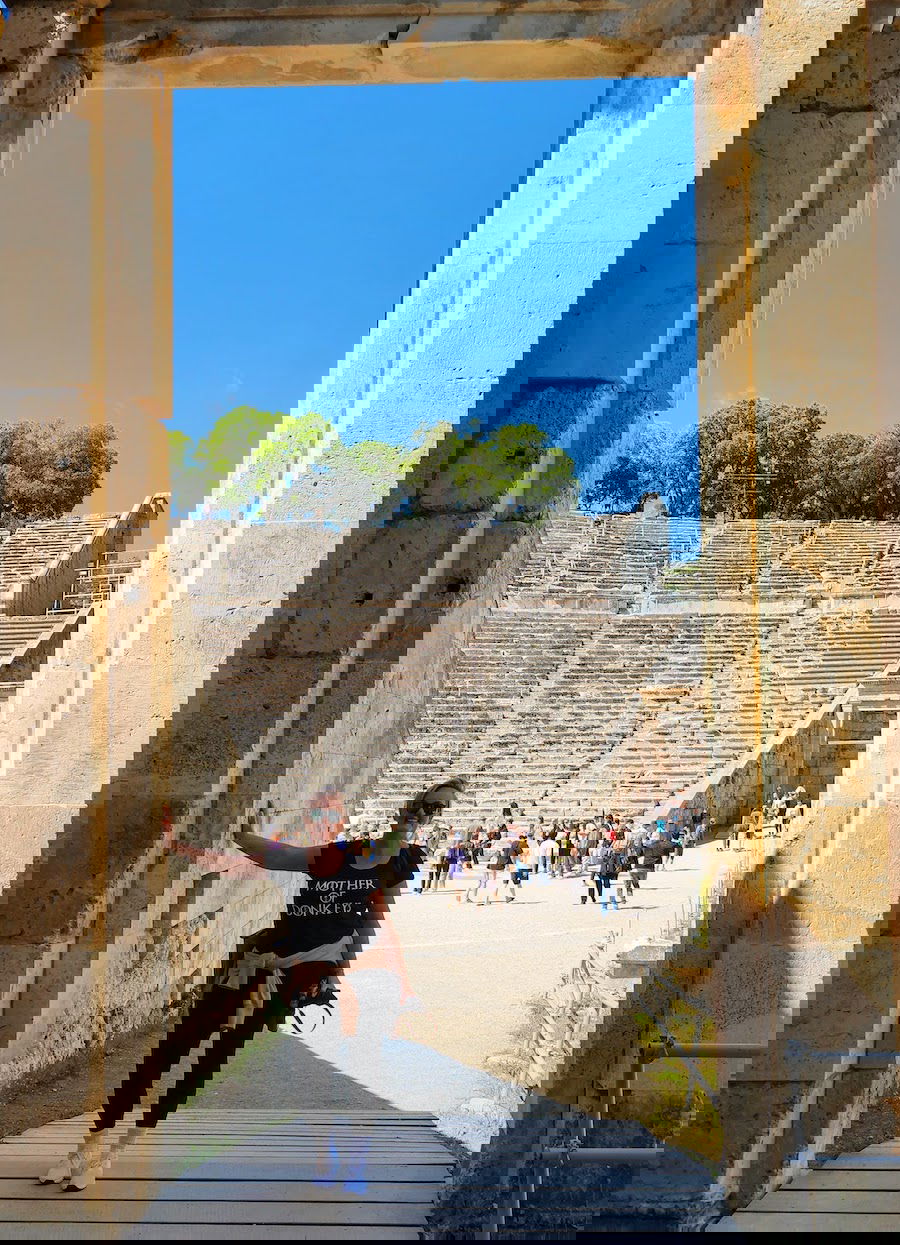SJ posing Ancient Stadium in Epidaurus - Greek Archaeological Sites In Greece