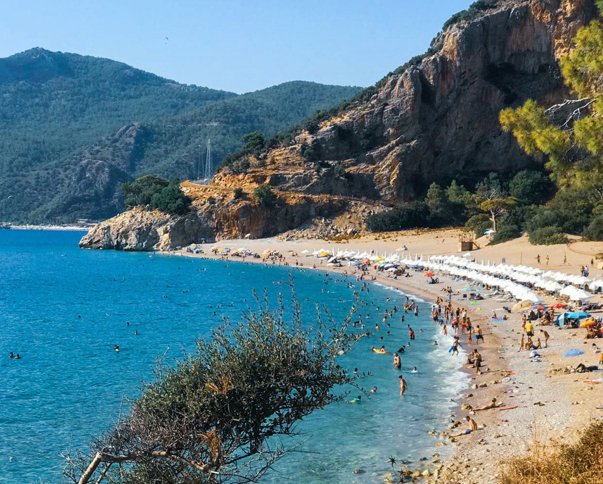 Kidrak beach with a lot of people on it.